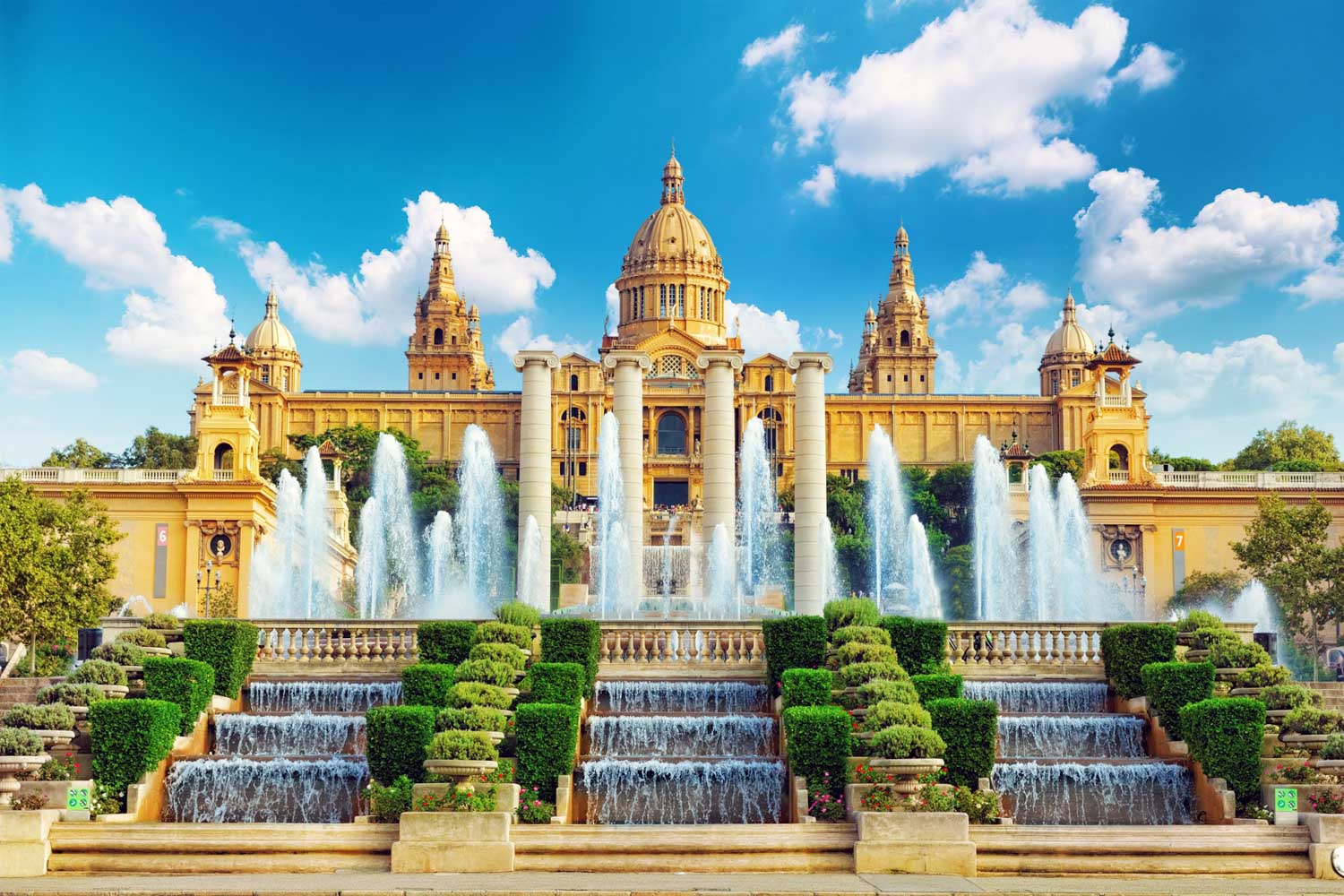 National Palace and Montjuïc fountains in Barcelona under a blue sky